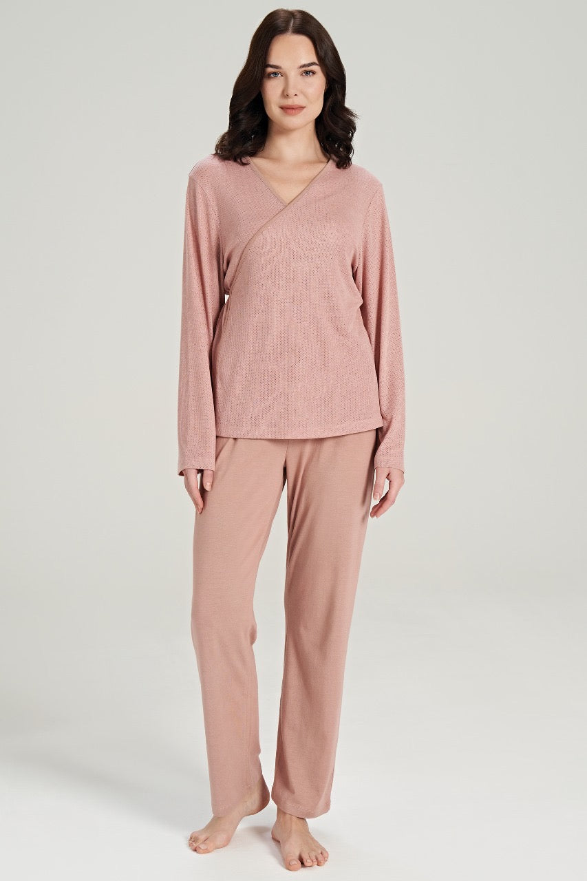 Model wearing Popjammies Women's Pink Loungewear Set, featuring a long-sleeve top and relaxed-fit pants, perfect for comfortable lounging and sleeping.