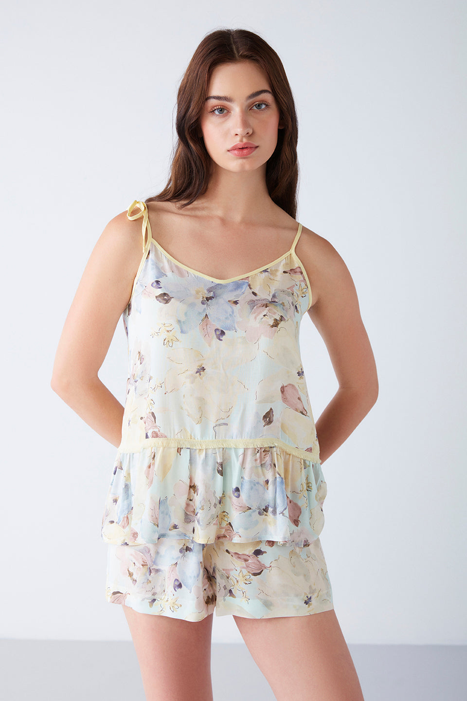 Close-up of the floral print pajama top with adjustable straps, showing the delicate design details.