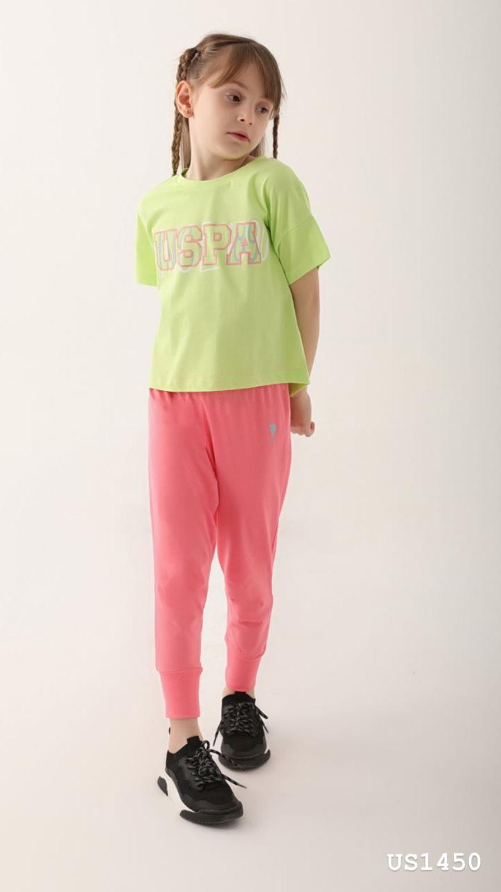 Child wearing the Popjammies Neon Vibe Pajama Set with a neon green top and pink joggers, looking stylish and comfortable.