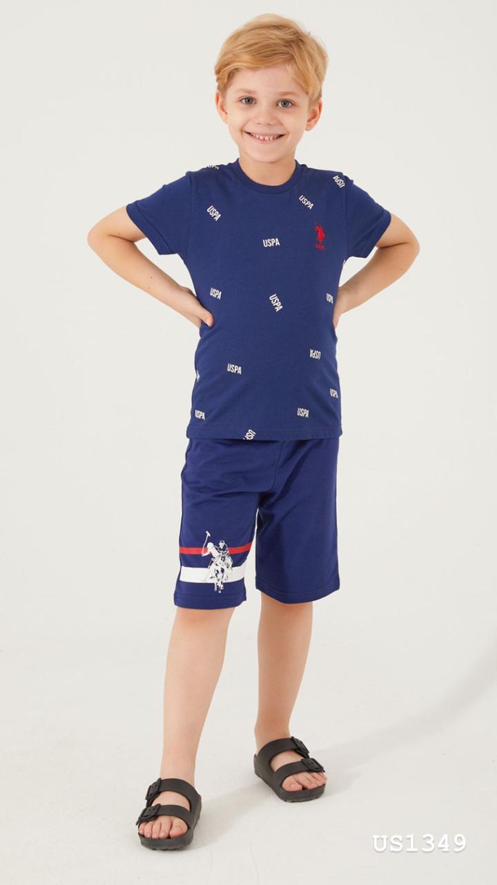 Boy wearing a navy blue t-shirt with a USPA pattern and matching navy blue shorts from Popjammies.