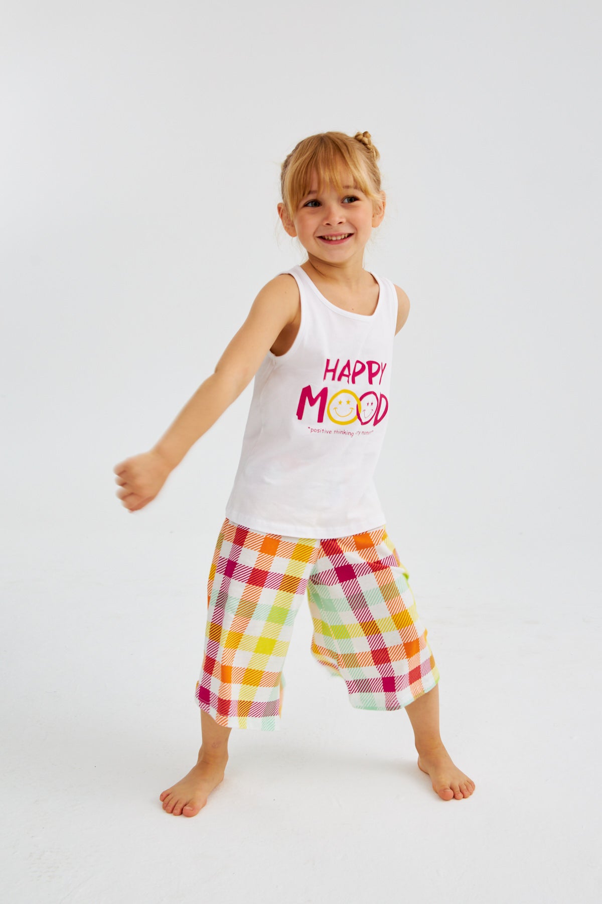 Little girl in "Happy Mood" pyjama set from Popjammies, dancing and having fun.