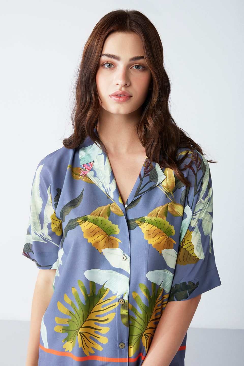 Close-up of the Popjammies Botanical Bliss Pajama Set's top, showcasing the button-up design and tropical print.