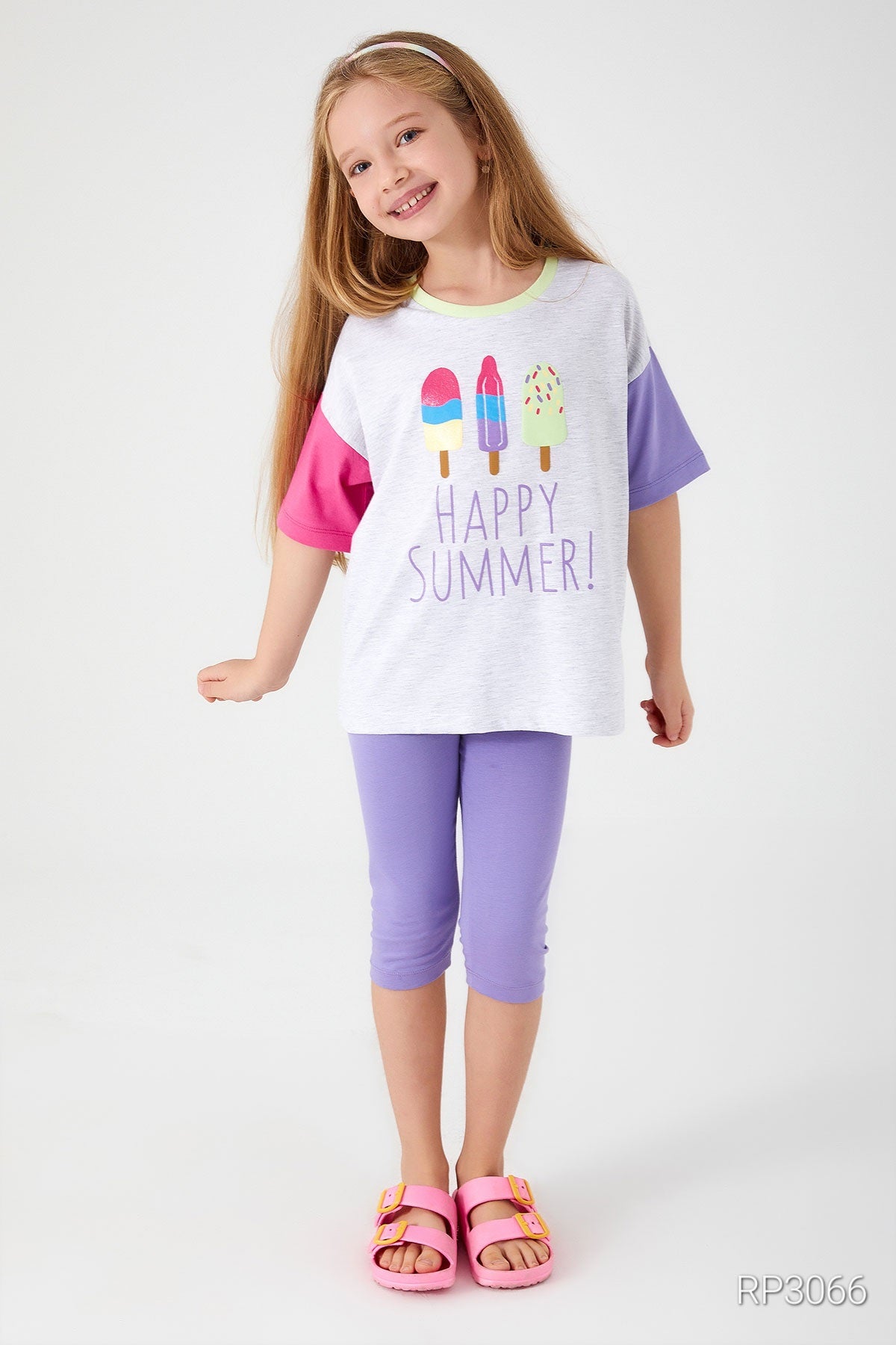 Front view of Popjammies 'Happy Summer' Pajama Set featuring a grey top with 'Happy Summer' text and ice cream graphic, with one pink sleeve and one purple sleeve, paired with purple short leggings.