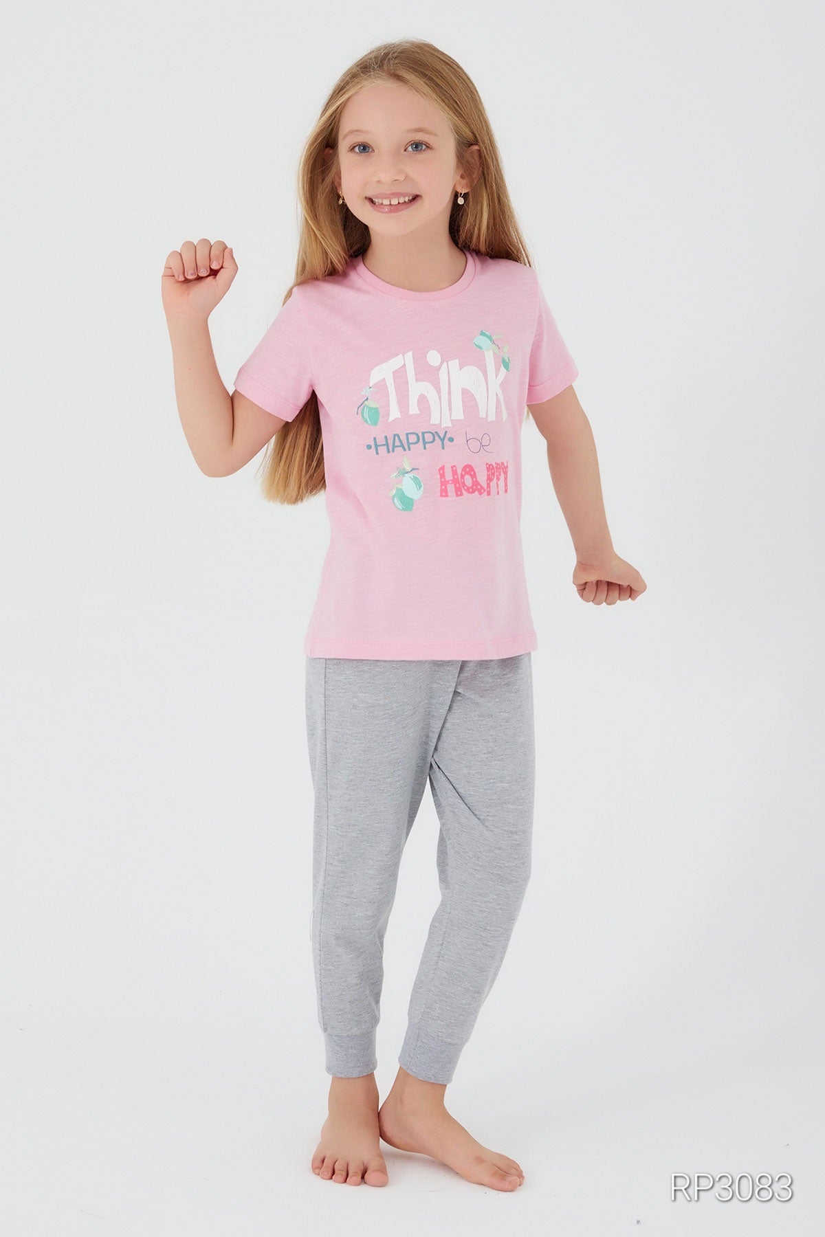 Girl wearing Popjammies Think Happy, Be Happy Pajama Set with pink top and grey pants , feeling happy