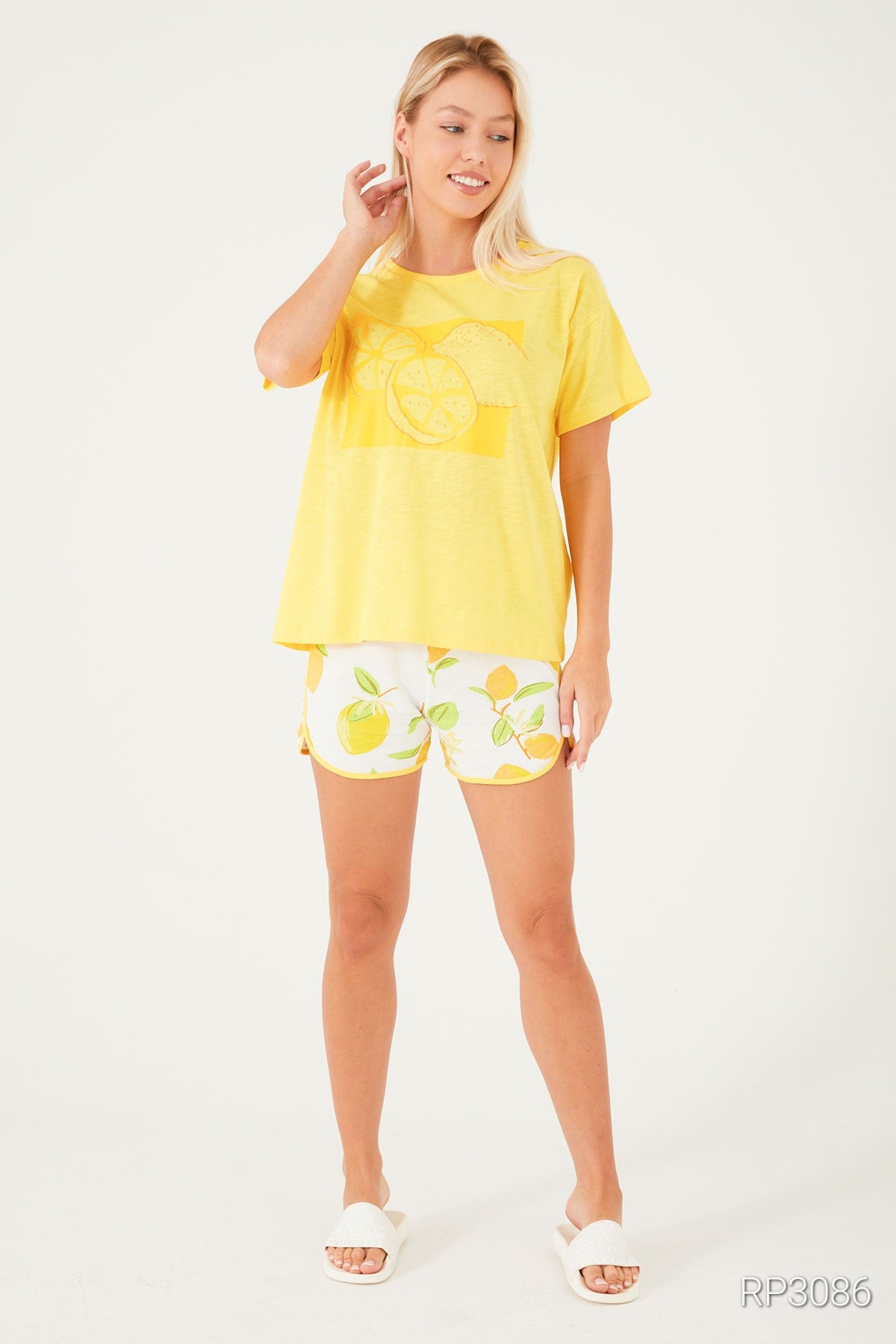 Model wearing a Popjammies pyjama set with a soft print, showcasing comfort and style.