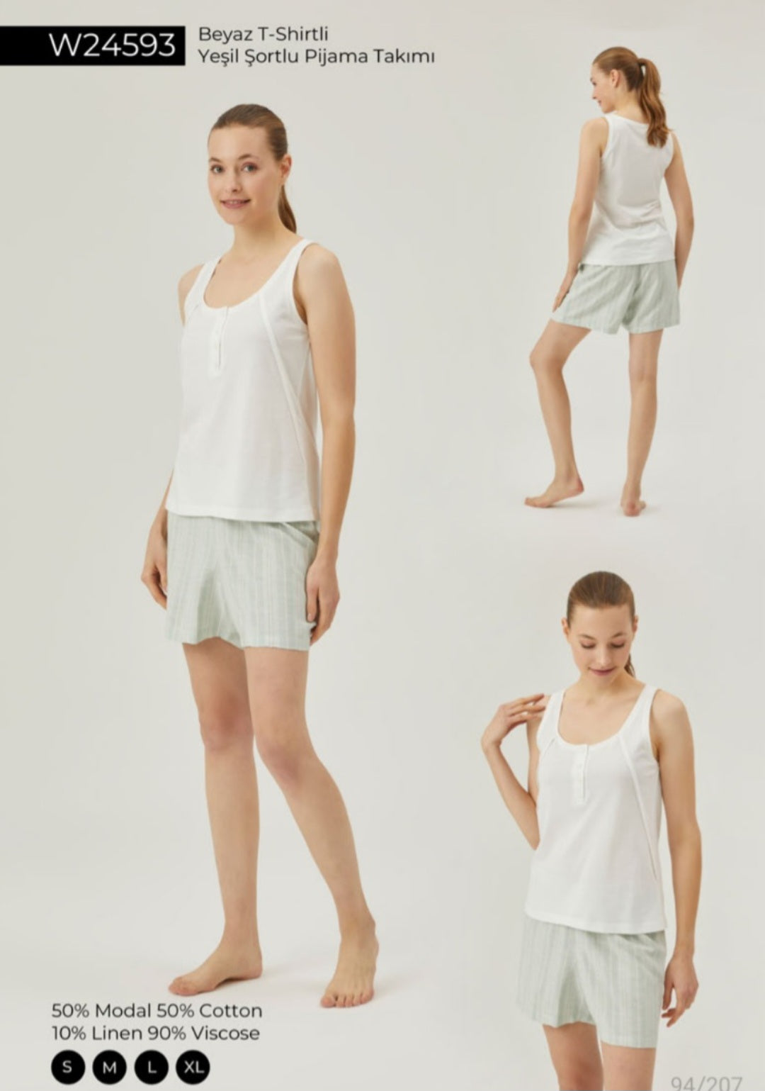 Woman wearing a white tank top and green stripped shorts pajama set