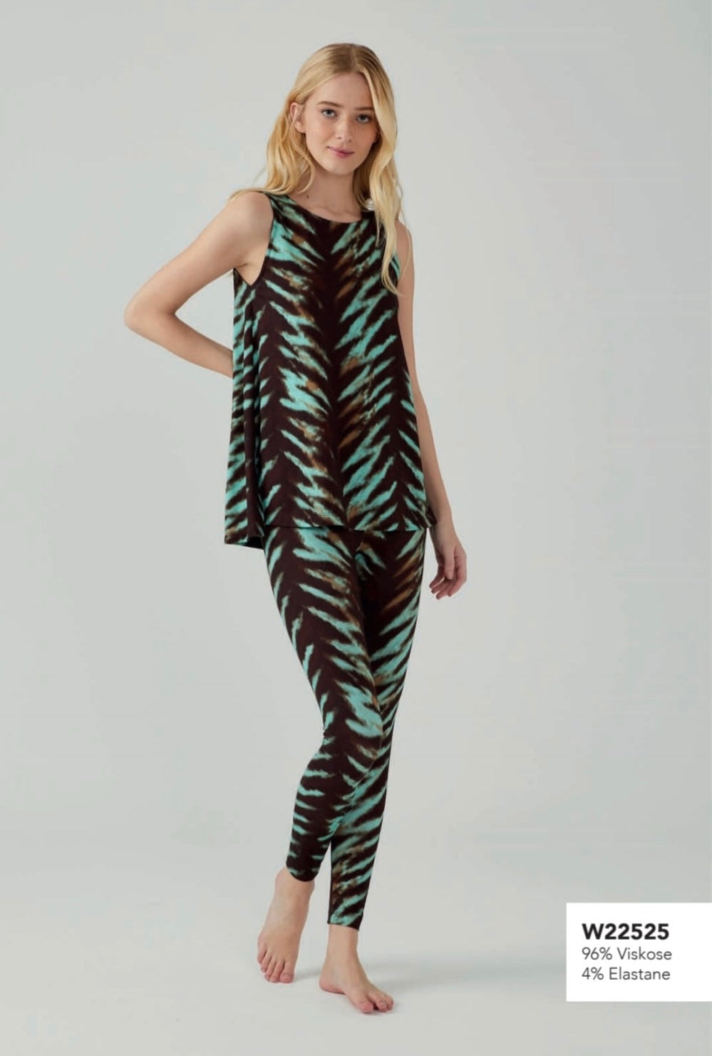 Model wearing Popjammies sleeveless pyjama set with black and teal zebra print, standing against a plain background.