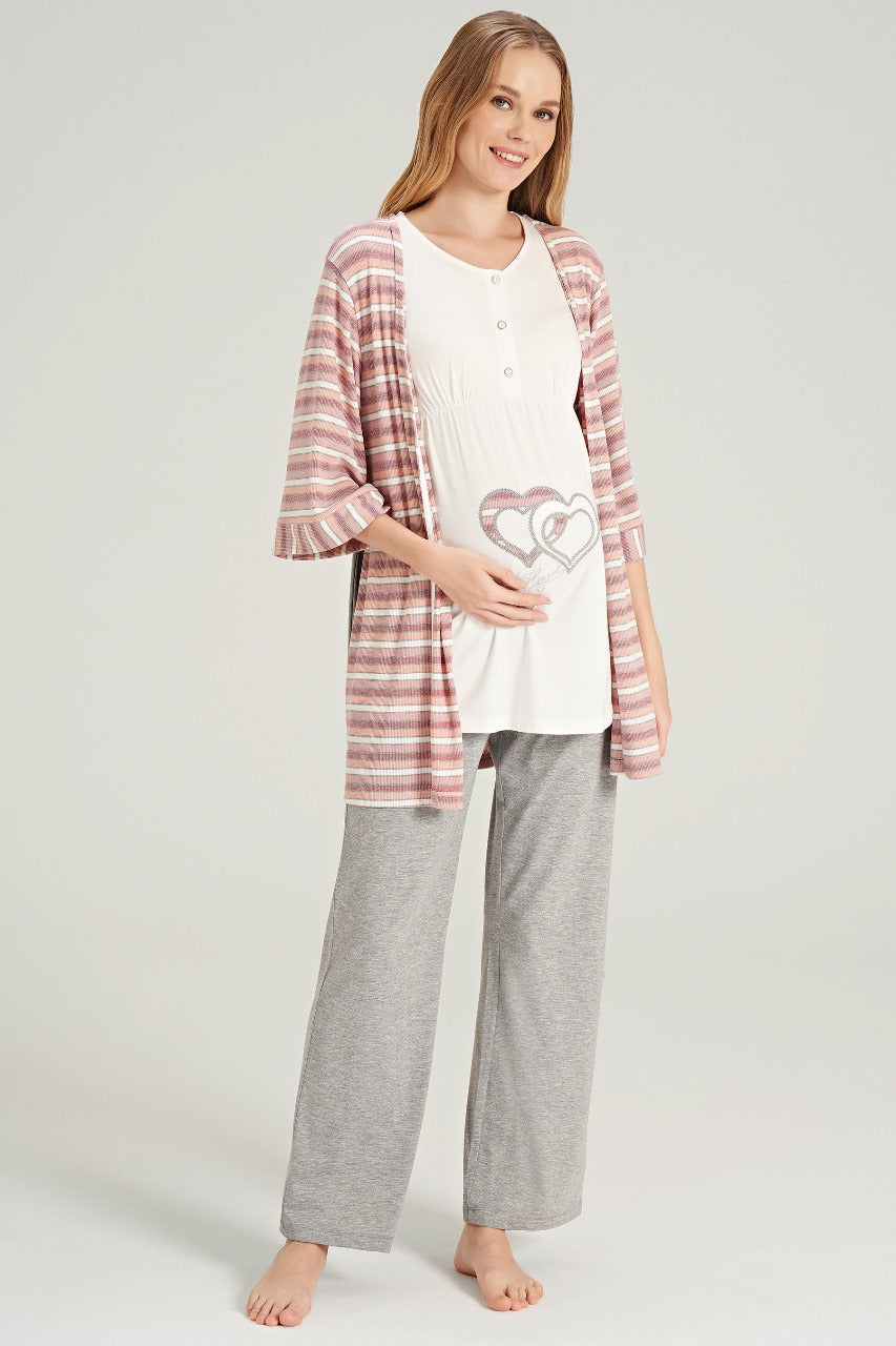 Woman wearing Popjammies pajama set with white top featuring heart embellishments and grey pants.