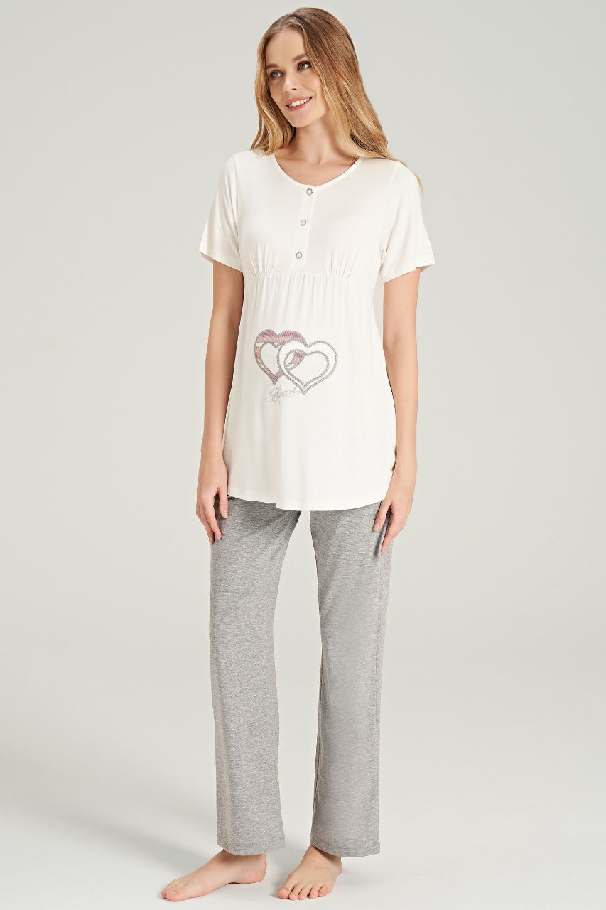 Close-up of white top with heart embellishments and grey pants from Popjammies pajama set.