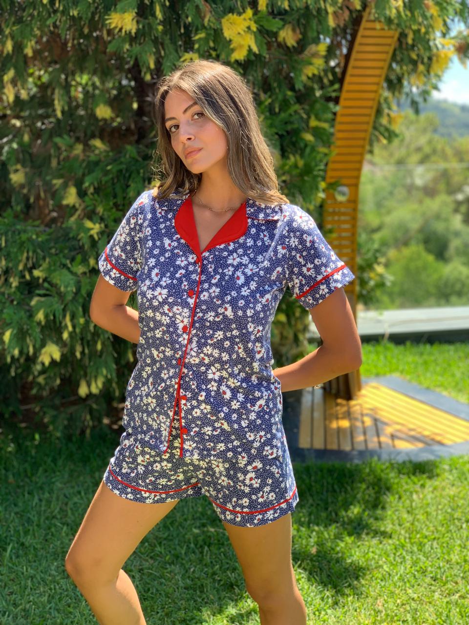 Woman wearing Popjammies Floral Pajama Set standing in a garden.