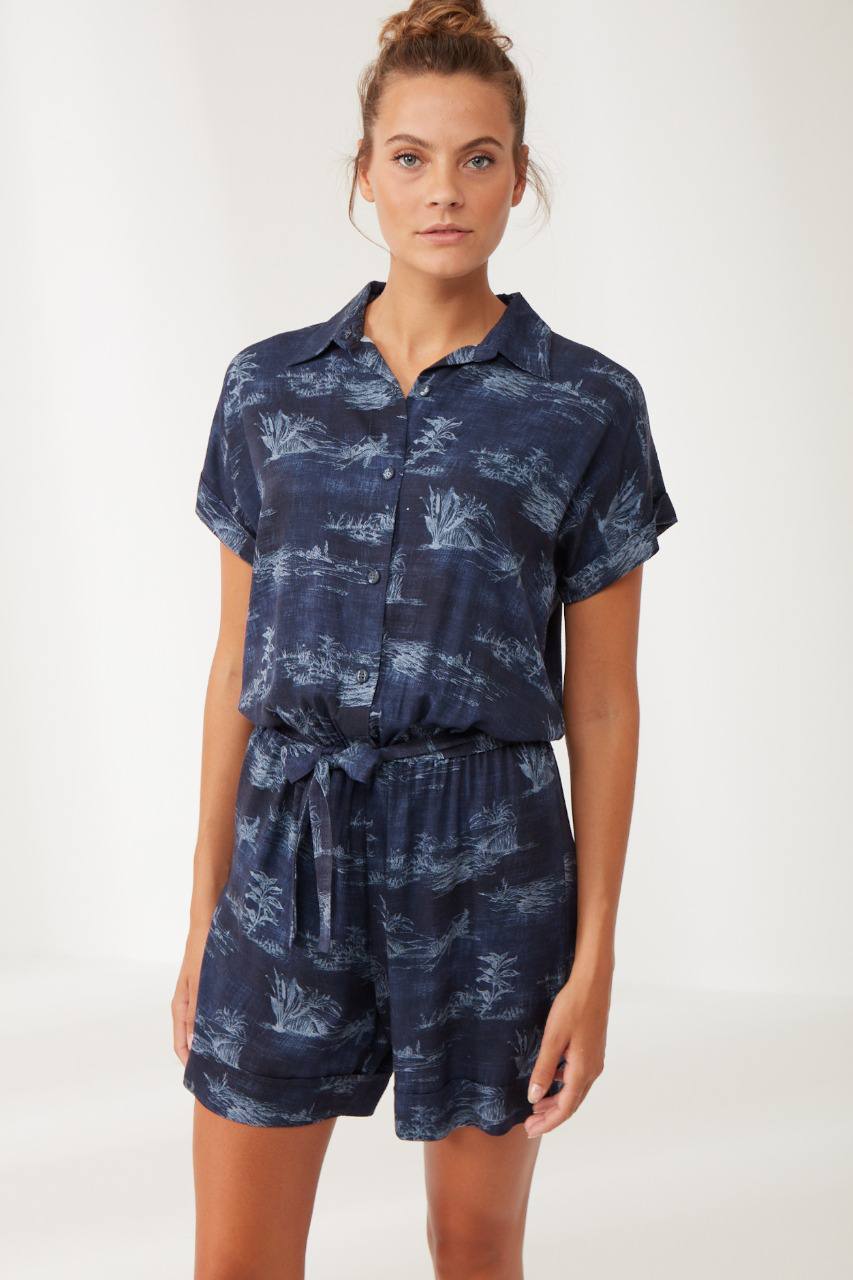 Model standing in Popjammies Women's Navy Printed Short Sleeve Pajama Set, showcasing the overall look and fit of the pajama set.